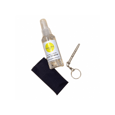 Lens cleaner spray bottle, microfiber cloth, and cleaning tool on a white background