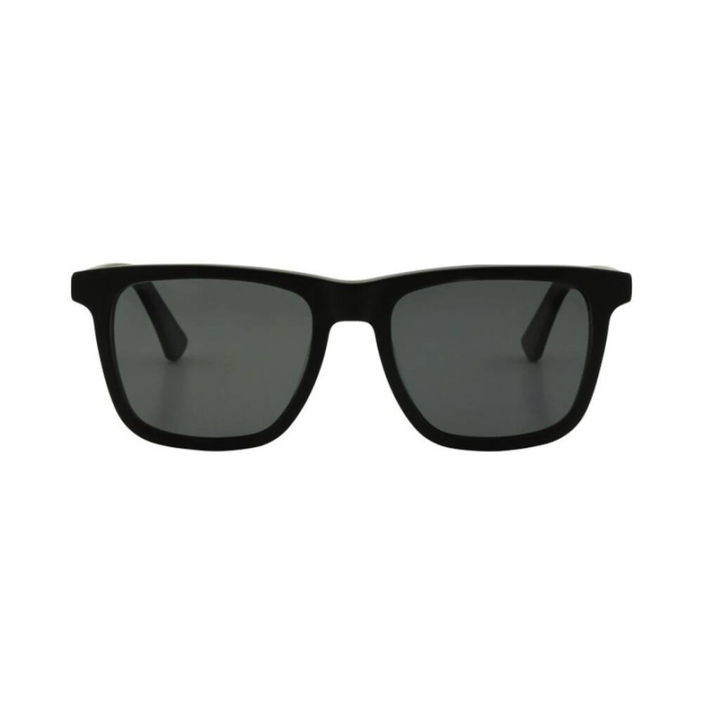 Black sunglasses with dark lenses on a white background
